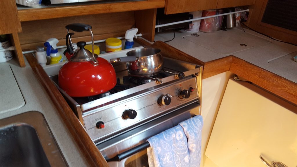 Image of range + oven tilted backwards on the kimbal