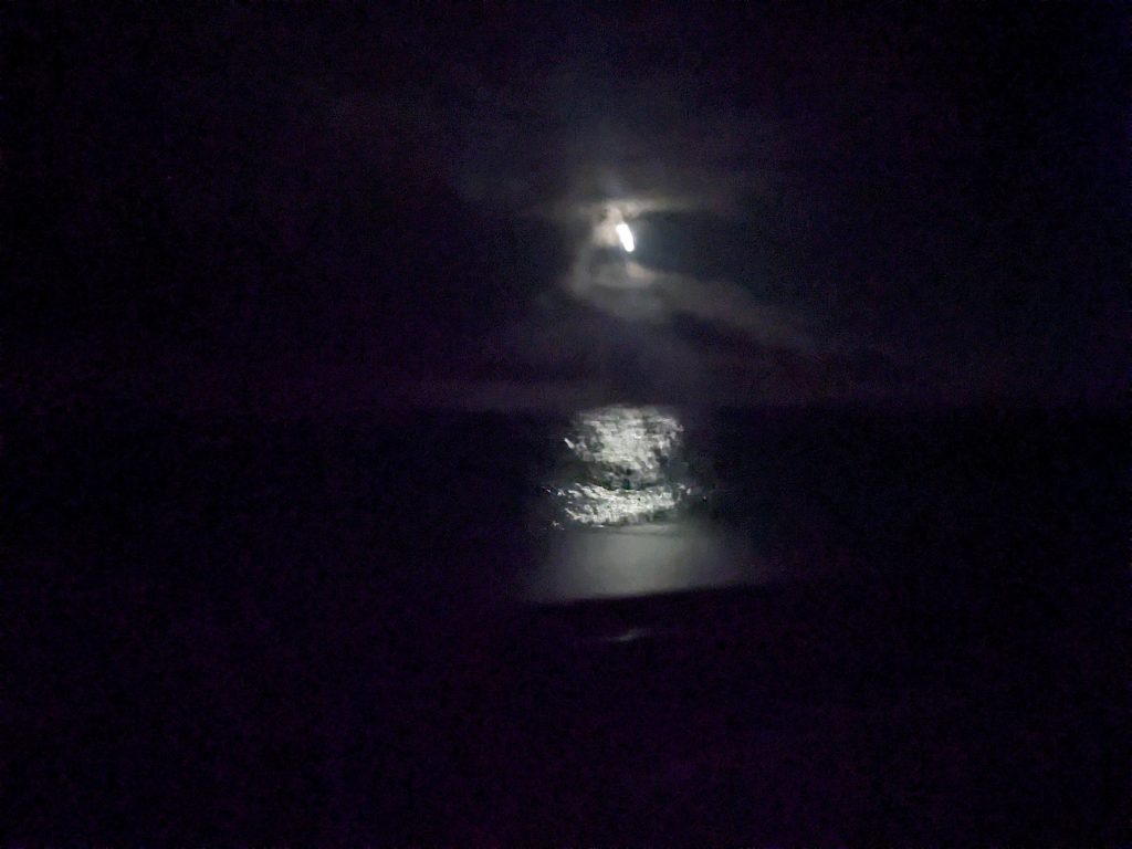 Image of a dark sky with the moon ahead