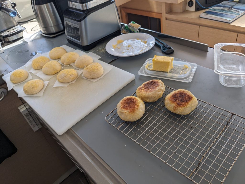 Image of English muffins resting on a cooling rack