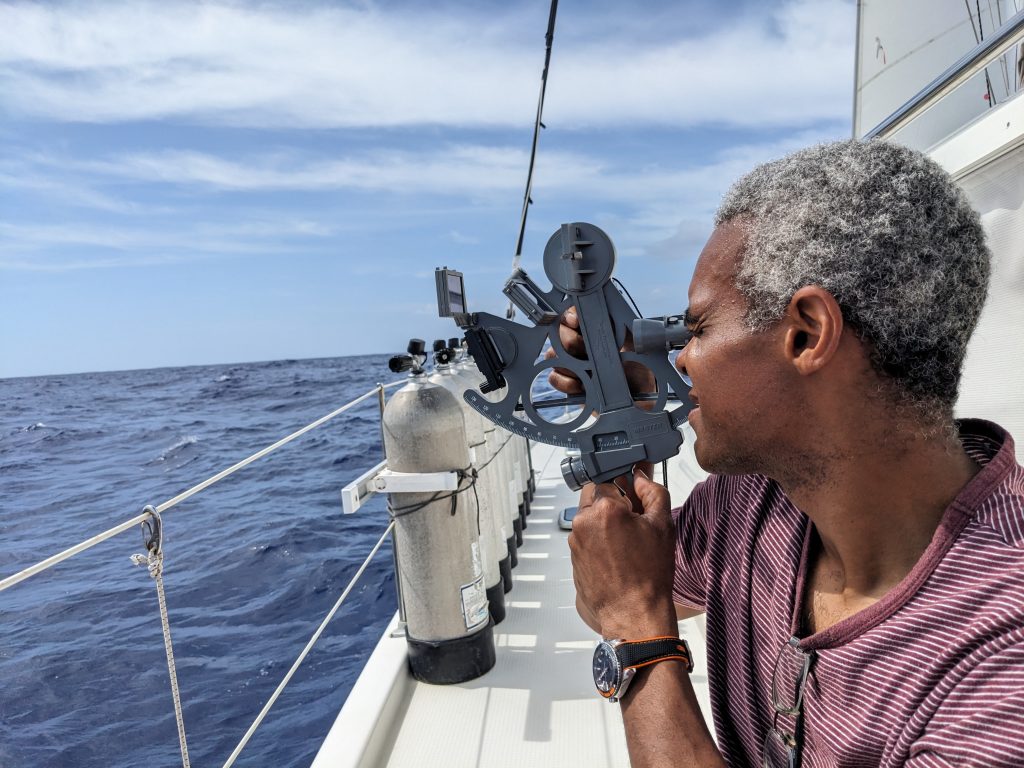 Image of a man sighting thorough a sextant