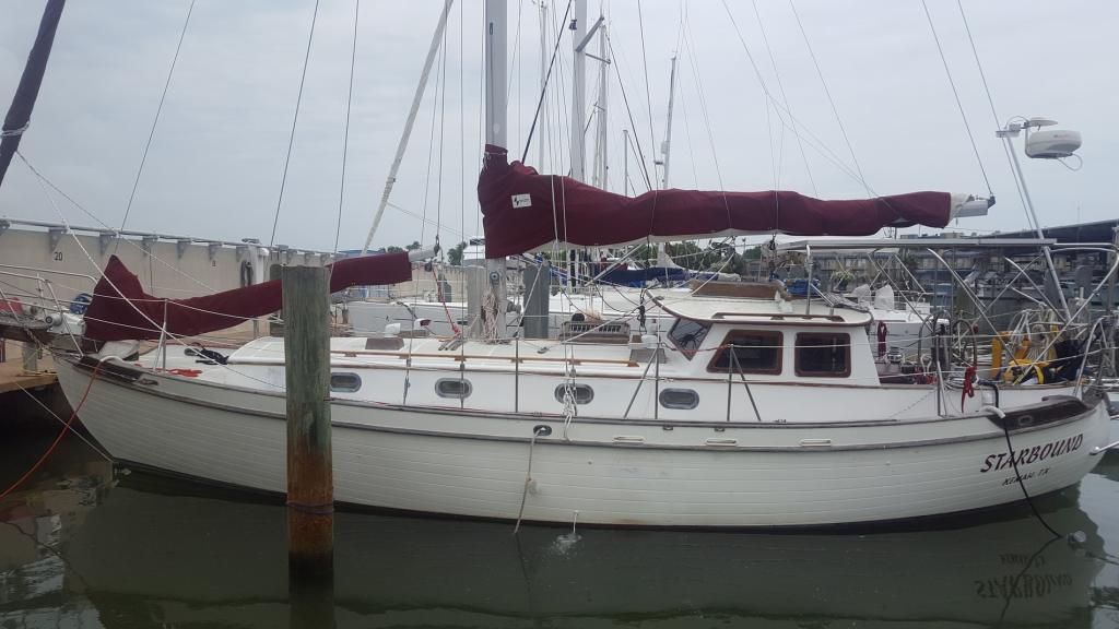 Image of sailing vessel Starbound in its slip in Galveston Bay marina